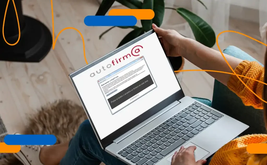 Person using the Autofirma application on a laptop to digitally sign documents from home