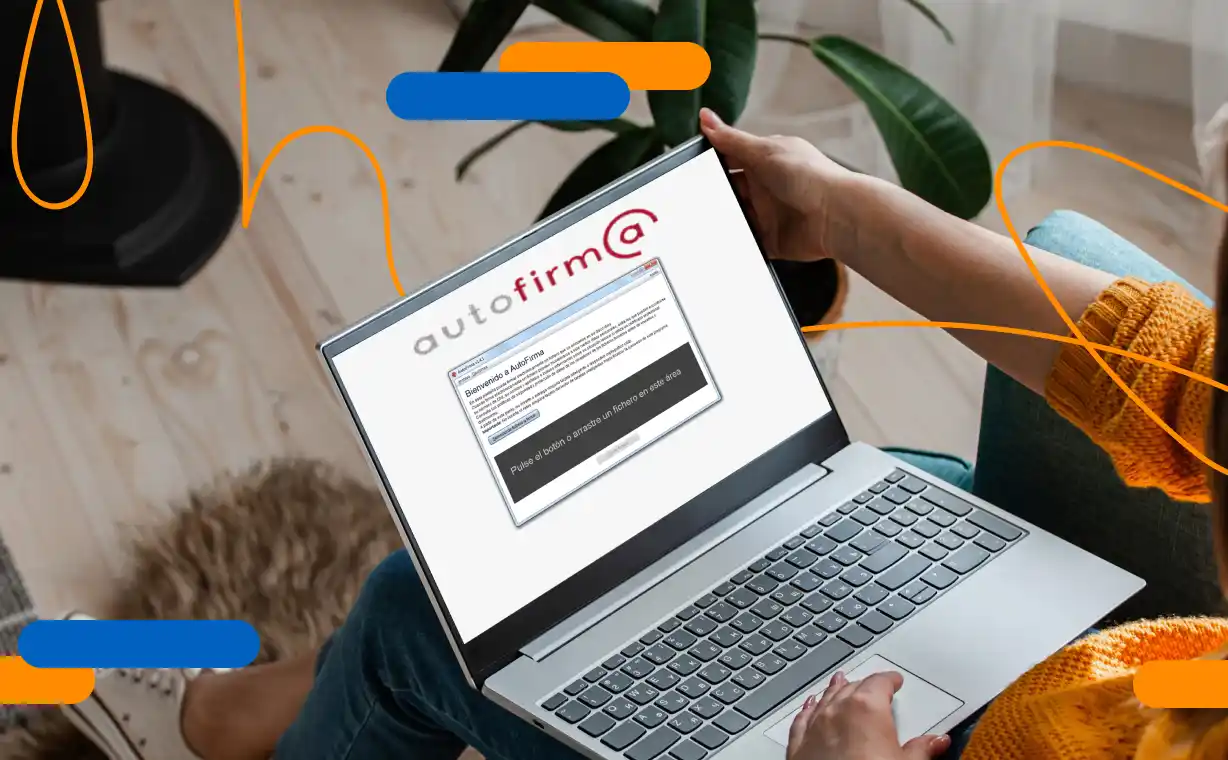 Person using the Autofirma application on a laptop to digitally sign documents from home